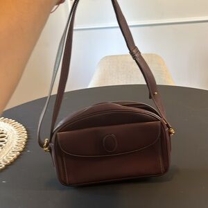 CARTIER. Must De Cartier Paris Bordeaux handbag.